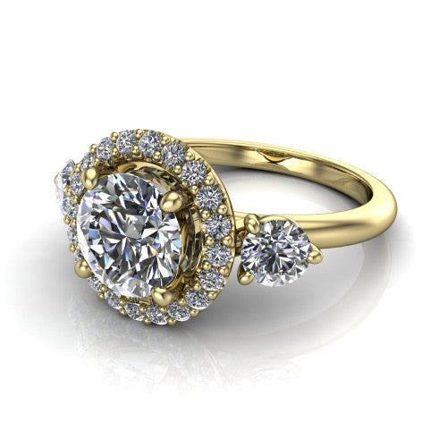 Carol round three stone halo engagement ring in 14K Yellow Gold, three-quarter perspective showing the round center in a squared pav&eacute; halo flanked by two round side stones above a plain band