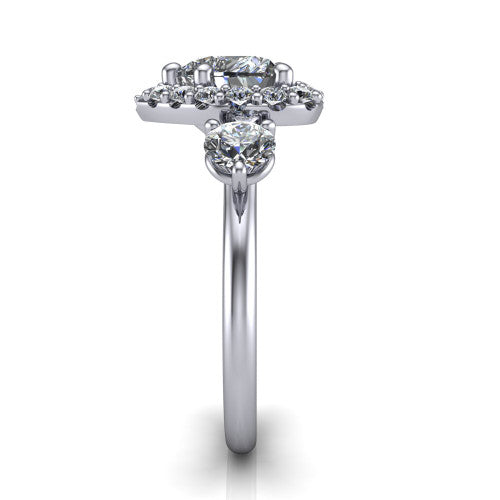 Carol heart three stone halo engagement ring in Platinum, side profile showing the plain polished band and the three-stone halo head in profile