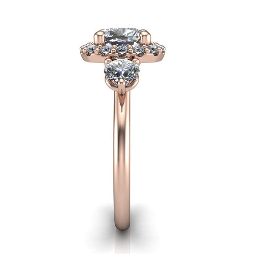 Carol cushion three stone halo engagement ring in 18K Rose Gold, side profile showing the plain polished band and the three-stone halo head in profile