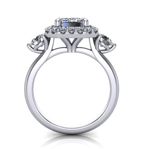 Carol emerald three stone halo engagement ring in Platinum, through-finger front profile showing the haloed center and side stones above the plain band