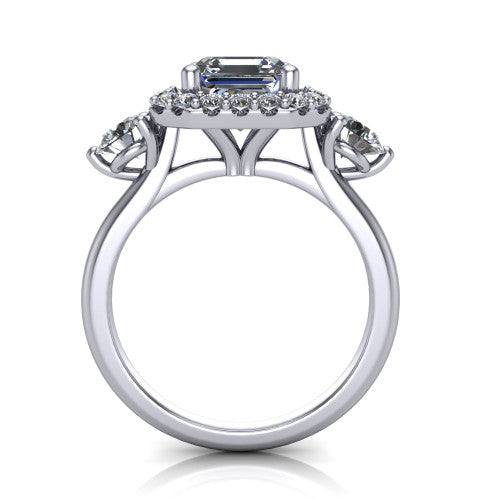 Carol square emerald three stone halo engagement ring in 18K White Gold, through-finger front profile showing the haloed center and side stones above the plain band