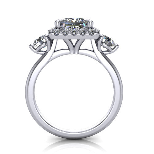 Carol princess three stone halo engagement ring in 18K White Gold, through-finger front profile showing the haloed center and side stones above the plain band
