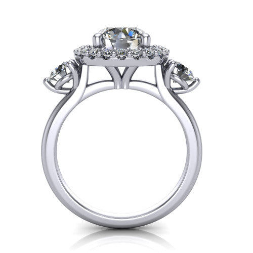 Carol round three stone halo engagement ring in Platinum, through-finger front profile showing the haloed center and side stones above the plain band