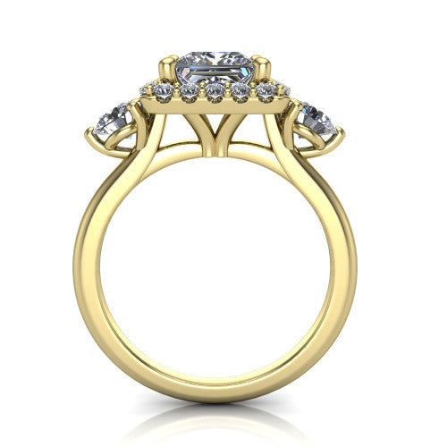 Carol princess three stone halo engagement ring in 18K Yellow Gold, through-finger front profile showing the haloed center and side stones above the plain band