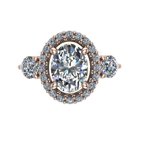 Carol oval three stone halo engagement ring in 18K Rose Gold, top-down view showing the squared pav&eacute; halo around the oval center and the two round accent diamonds
