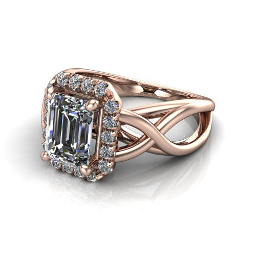 Coco emerald halo engagement ring in 18K Rose Gold, three-quarter perspective showing the emerald center in a squared pav&eacute; halo above a woven infinity split shank