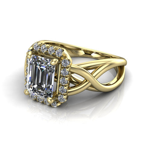 Coco emerald halo engagement ring in 14K Yellow Gold, three-quarter perspective showing the emerald center in a squared pav&eacute; halo above a woven infinity split shank