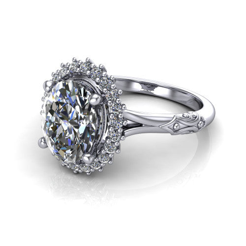 Lillian oval vintage halo engagement ring in 18K White Gold, three-quarter perspective showing the oval center in a squared pav&eacute; halo above an engraved filigree band