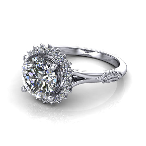 Lillian round vintage halo engagement ring in Platinum, three-quarter perspective showing the round center in a squared pav&eacute; halo above an engraved filigree band