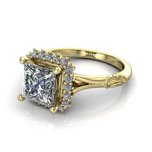 Lillian princess vintage halo engagement ring in 18K Yellow Gold, three-quarter perspective showing the princess center in a squared pav&eacute; halo above an engraved filigree band