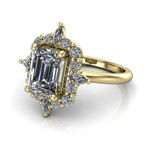 Frances emerald vintage halo engagement ring in 14K Yellow Gold, three-quarter perspective showing the emerald center in a marquise and round starburst halo above a plain band