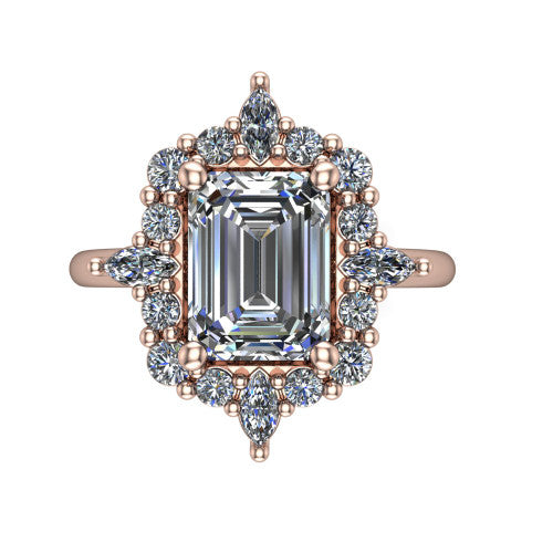 Frances emerald vintage halo engagement ring in 14K Rose Gold, top-down view showing the snowflake starburst halo of marquise and round diamonds framing the emerald center
