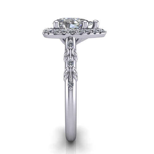 Eleanor pear vintage halo engagement ring in Platinum, side profile showing the floral filigree leaf scrollwork on the pav&eacute; band and the squared halo in profile