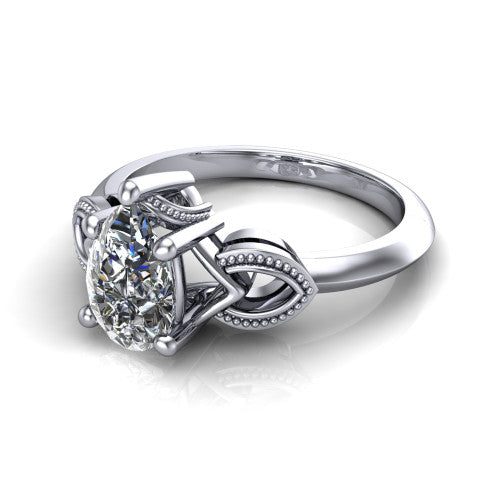 Ella pear vintage solitaire engagement ring in 18K White Gold, three-quarter perspective showing the pear center on claw prongs above a plain band with vintage filigree shoulders