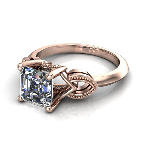Ella square emerald vintage solitaire engagement ring in 18K Rose Gold, three-quarter perspective showing the square emerald center on claw prongs above a plain band with vintage filigree shoulders