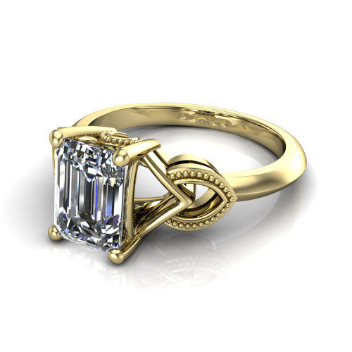 Ella emerald vintage solitaire engagement ring in 18K Yellow Gold, three-quarter perspective showing the emerald center on claw prongs above a plain band with vintage filigree shoulders