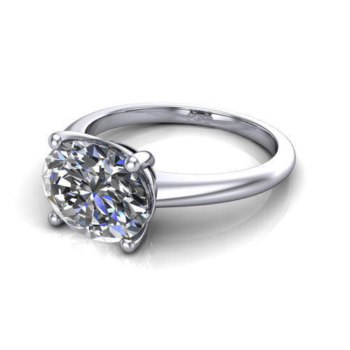 Avery oval classic solitaire engagement ring in 18K White Gold, three-quarter perspective showing the oval center on claw prongs above a plain polished band