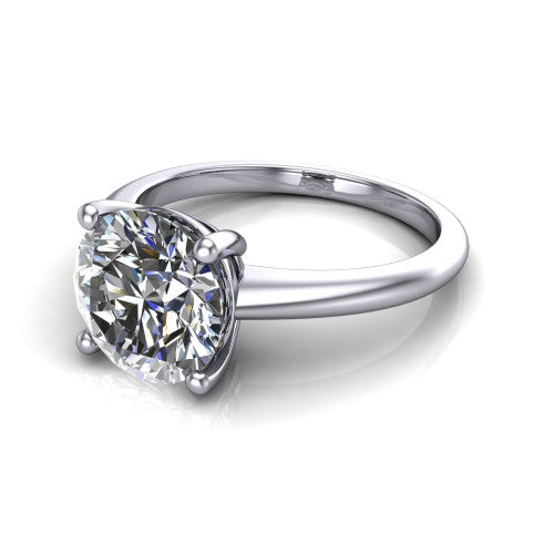Avery round classic solitaire engagement ring in 14K White Gold, three-quarter perspective showing the round center on claw prongs above a plain polished band