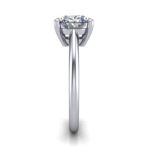 Avery oval classic solitaire engagement ring in Platinum, side profile showing the smooth polished band and the open basket beneath the oval center