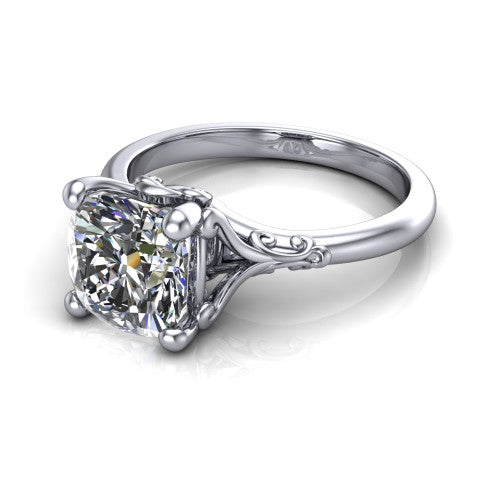 Dorothy cushion vintage solitaire engagement ring in 18K White Gold, three-quarter perspective showing the cushion center on claw prongs above a plain band with vintage filigree scrollwork