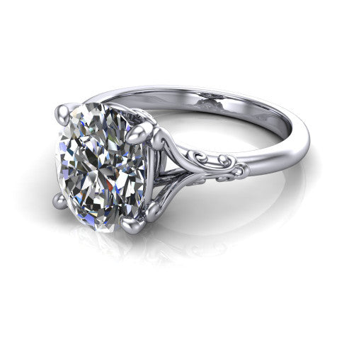 Dorothy oval vintage solitaire engagement ring in Platinum, three-quarter perspective showing the oval center on claw prongs above a plain band with vintage filigree scrollwork