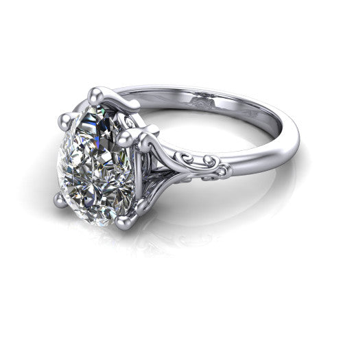 Dorothy pear vintage solitaire engagement ring in 18K White Gold, three-quarter perspective showing the pear center on claw prongs above a plain band with vintage filigree scrollwork