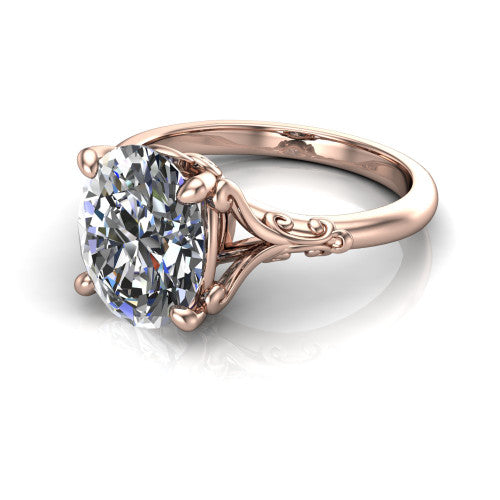 Dorothy oval vintage solitaire engagement ring in 18K Rose Gold, three-quarter perspective showing the oval center on claw prongs above a plain band with vintage filigree scrollwork
