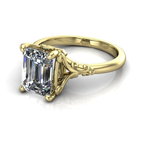 Dorothy emerald vintage solitaire engagement ring in 14K Yellow Gold, three-quarter perspective showing the emerald center on claw prongs above a plain band with vintage filigree scrollwork