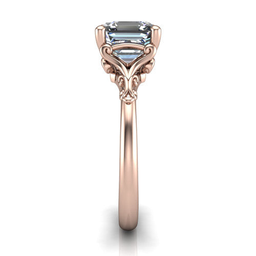 Dorothy square emerald vintage solitaire engagement ring in 18K Rose Gold, side profile showing the vintage filigree scrollwork, milgrain detail, and plain band in profile