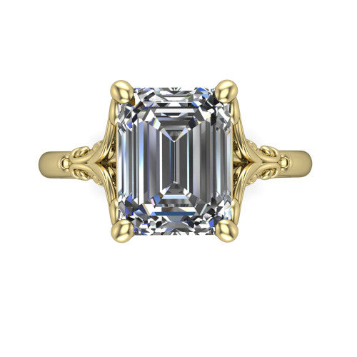 Dorothy emerald vintage solitaire engagement ring in 18K Yellow Gold, top-down view showing the emerald solitaire center and the filigree scrollwork flanking the head