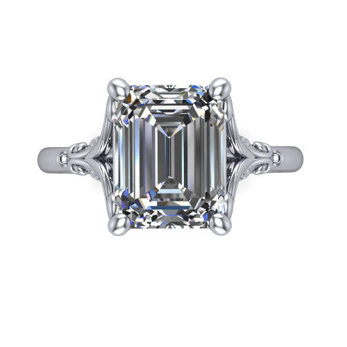 Dorothy emerald vintage solitaire engagement ring in 18K White Gold, top-down view showing the emerald solitaire center and the filigree scrollwork flanking the head