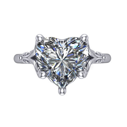 Dorothy heart vintage solitaire engagement ring in Platinum, top-down view showing the heart solitaire center and the filigree scrollwork flanking the head