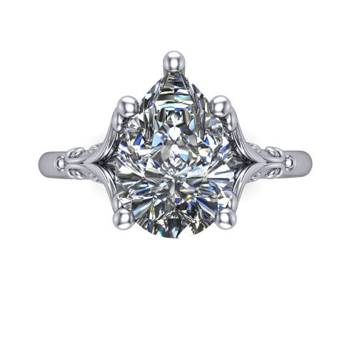 Dorothy pear vintage solitaire engagement ring in Platinum, top-down view showing the pear solitaire center and the filigree scrollwork flanking the head