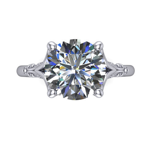 Dorothy round vintage solitaire engagement ring in 18K White Gold, top-down view showing the round solitaire center and the filigree scrollwork flanking the head