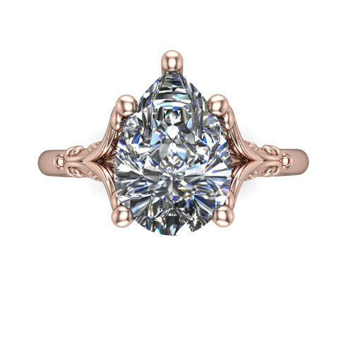 Dorothy pear vintage solitaire engagement ring in 18K Rose Gold, top-down view showing the pear solitaire center and the filigree scrollwork flanking the head