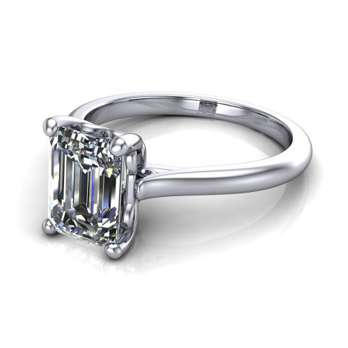Margaret emerald classic solitaire engagement ring in 14K White Gold, three-quarter perspective showing the emerald center on claw prongs above a plain polished band