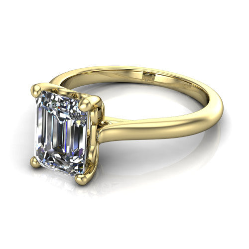 Margaret emerald classic solitaire engagement ring in 14K Yellow Gold, three-quarter perspective showing the emerald center on claw prongs above a plain polished band