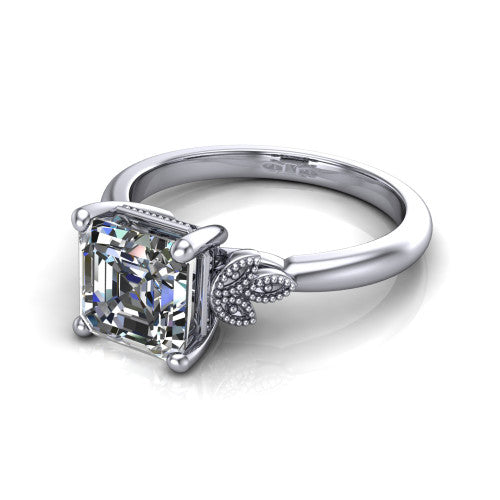 Athena square emerald vintage solitaire engagement ring in Platinum, three-quarter perspective showing the square emerald center on claw prongs above a plain band with fleur-de-lis filigree accents