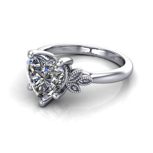 Athena heart vintage solitaire engagement ring in 14K White Gold, three-quarter perspective showing the heart center on claw prongs above a plain band with fleur-de-lis filigree accents