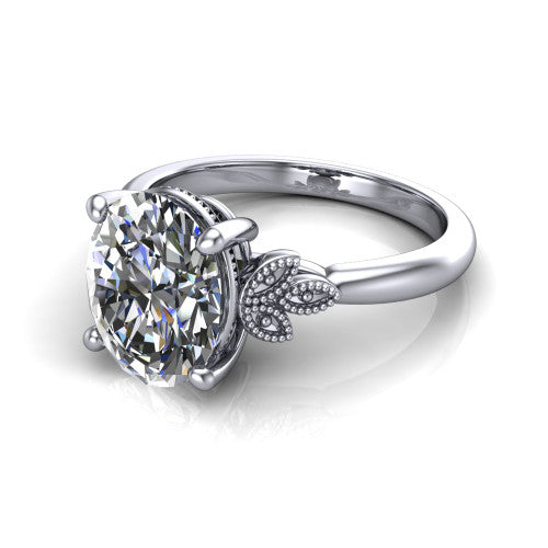 Athena oval vintage solitaire engagement ring in 14K White Gold, three-quarter perspective showing the oval center on claw prongs above a plain band with fleur-de-lis filigree accents