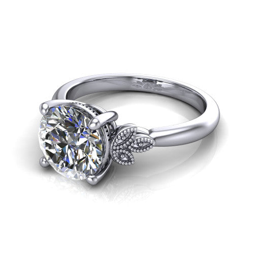 Athena round vintage solitaire engagement ring in Platinum, three-quarter perspective showing the round center on claw prongs above a plain band with fleur-de-lis filigree accents