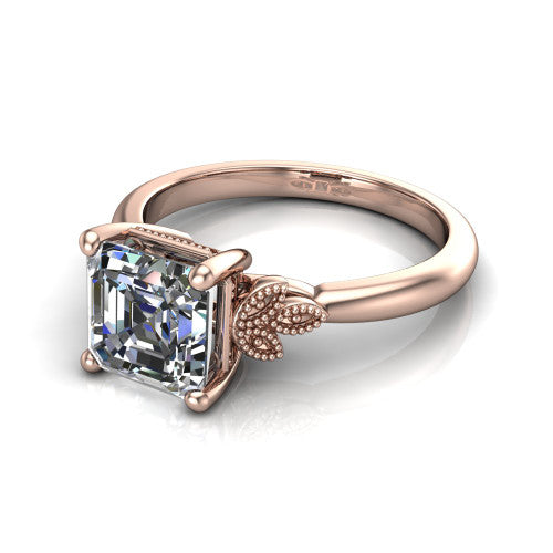 Athena square emerald vintage solitaire engagement ring in 14K Rose Gold, three-quarter perspective showing the square emerald center on claw prongs above a plain band with fleur-de-lis filigree accents