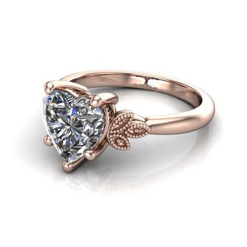 Athena heart vintage solitaire engagement ring in 18K Rose Gold, three-quarter perspective showing the heart center on claw prongs above a plain band with fleur-de-lis filigree accents