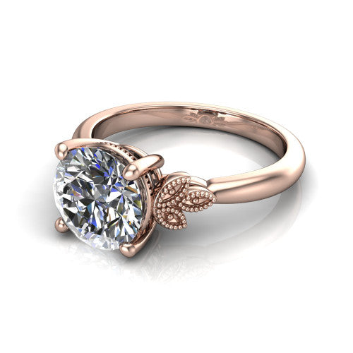 Athena round vintage solitaire engagement ring in 18K Rose Gold, three-quarter perspective showing the round center on claw prongs above a plain band with fleur-de-lis filigree accents