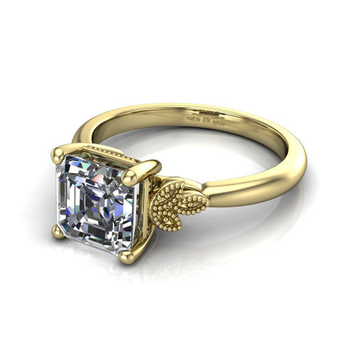 Athena square emerald vintage solitaire engagement ring in 14K Yellow Gold, three-quarter perspective showing the square emerald center on claw prongs above a plain band with fleur-de-lis filigree accents