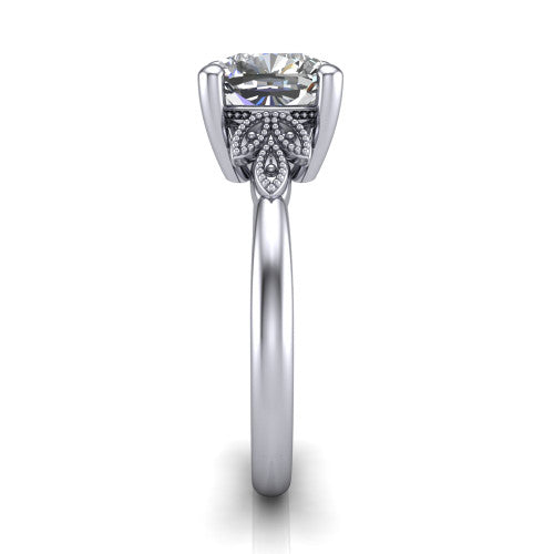 Athena cushion vintage solitaire engagement ring in Platinum, side profile showing the fleur-de-lis filigree accents, milgrain detail, and plain band in profile