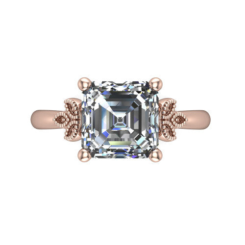 Athena square emerald vintage solitaire engagement ring in 18K Rose Gold, top-down view showing the square emerald solitaire center and the fleur-de-lis filigree flanking the head