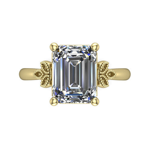 Athena emerald vintage solitaire engagement ring in 18K Yellow Gold, top-down view showing the emerald solitaire center and the fleur-de-lis filigree flanking the head