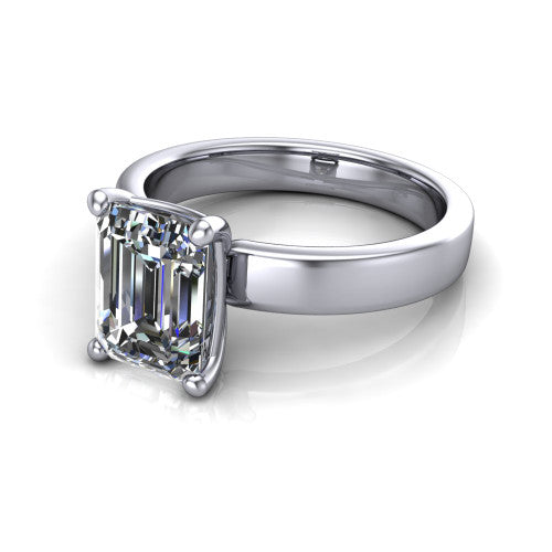 Louise emerald classic solitaire engagement ring in 14K White Gold, three-quarter perspective showing the emerald center on claw prongs above a wide flat polished band