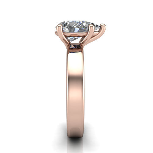 Louise pear classic solitaire engagement ring in 14K Rose Gold, side profile showing the substantial flat polished band and the open basket beneath the pear center